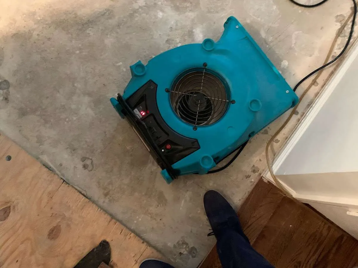 Air mover drying subfloor during Leak Detection & Repair in San Diego Country Estates